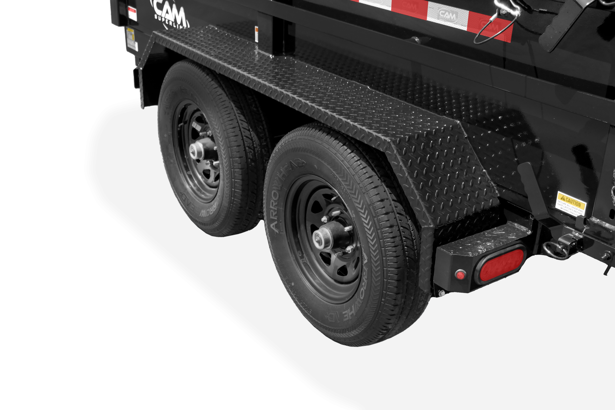 Cam Superline | Standard Duty Low Profile Dump Trailer | Image | Left side of black Standard Duty Low Profile Dump Trailer with reflective tape, close-up of wheels