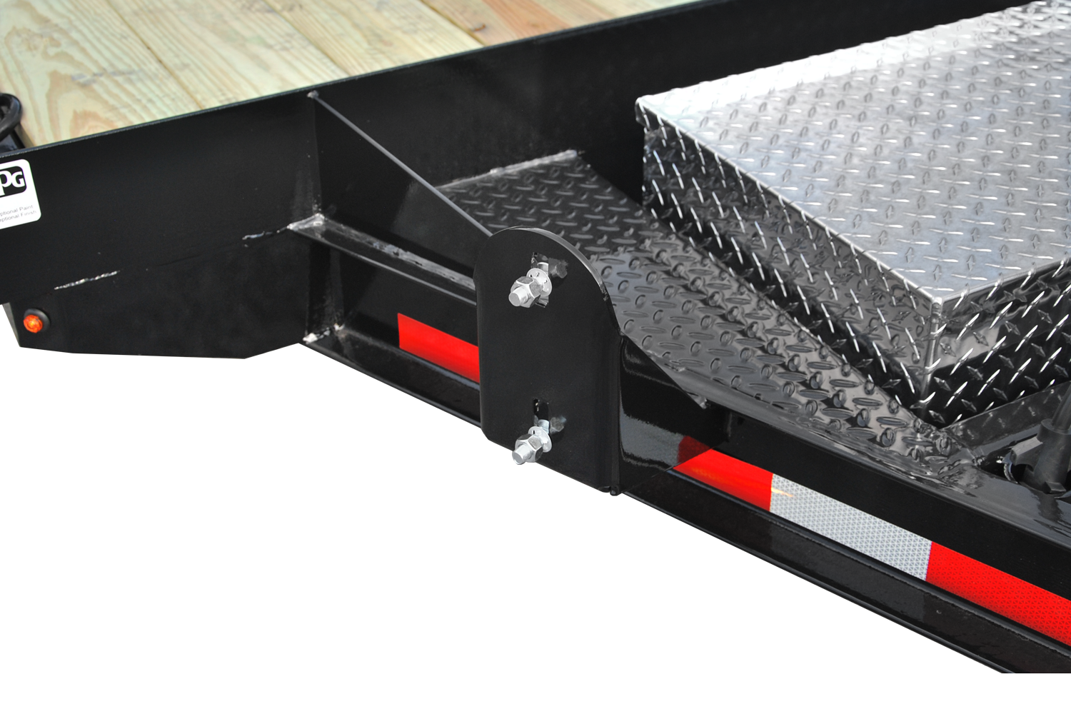 Cam Superline | Single Axle Low Profile Dump Trailer | Image | Front side of black Single Axle Low Profile Dump Trailer with reflective tape, close-up of spare tire mount